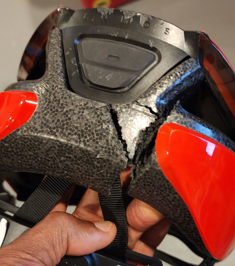 Customer photo: the back of a Lumos helmet with a cracked shell after a fall
