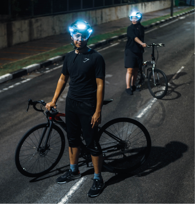 bike helmet on man Lumos Ultra MIPs Smart E-Bike Helmet