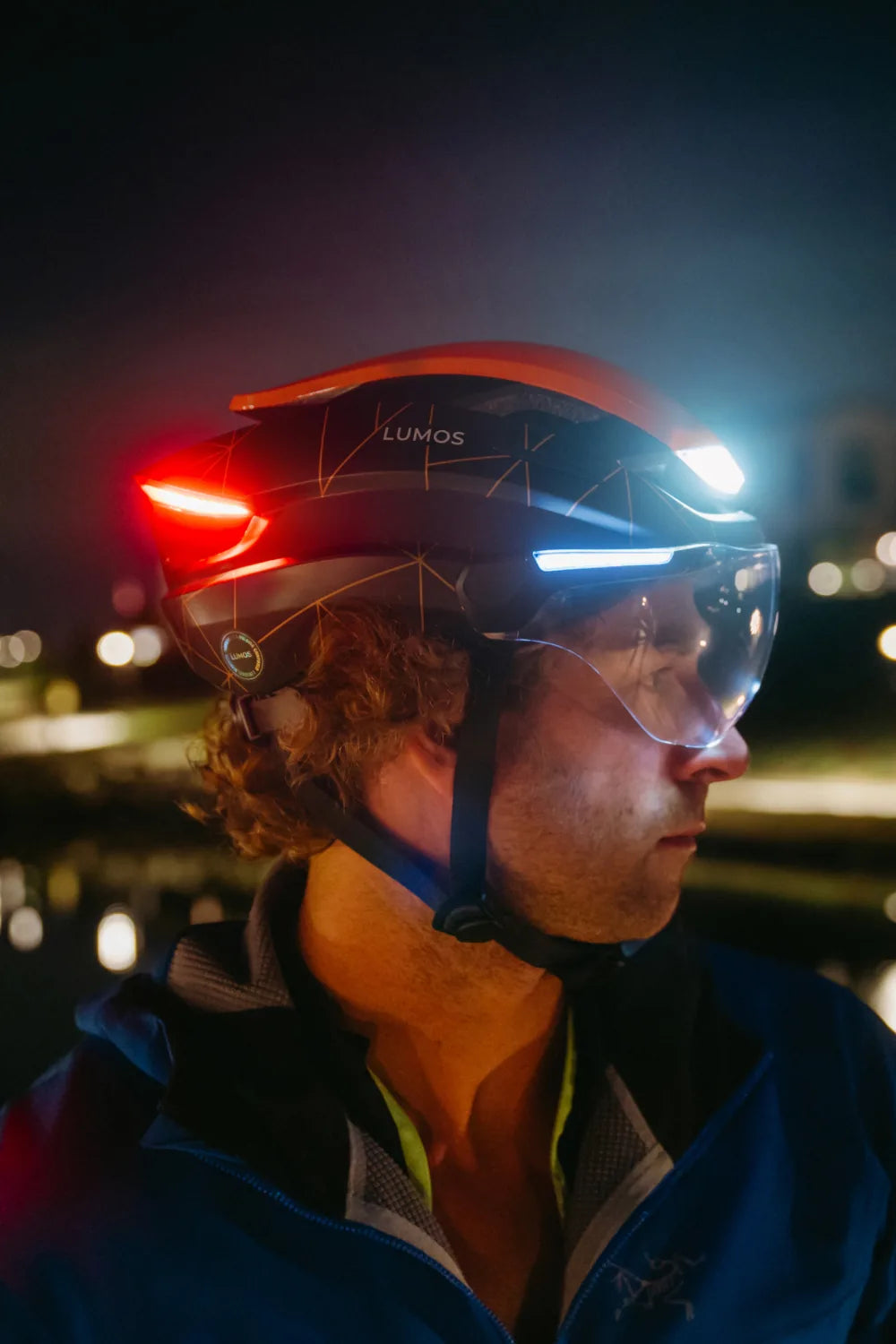 Rider at night wearing Lumos Ultra E-Bike in Cinder Trail with the lights on